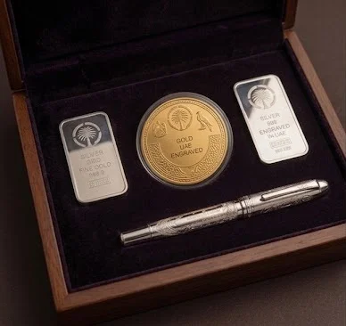 Gift close-up — engraved gold or silver, low light